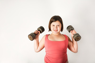 Chubby fat preteen girl with large dumbbells