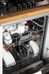 New dishwasher. Built-in dishwasher in kitchen.