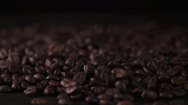 Falling coffee beans,Close up of seeds of coffee. Beautiful seeds of coffee.