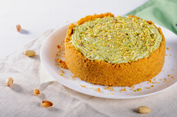 Homemade pistachio cheesecake on the table