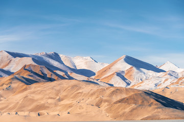 White and yellow sandy mountain with snow covered located in Xinjiang China Tashkurgan(Taxkorgan).