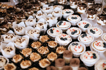  Beautiful Candy bar at wedding ceremony with desserts,  cakes