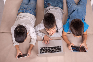 Children of different ages use gadgets for games, communication and for learning.  Modern lifestyle.  Social issue. © rozaivn58