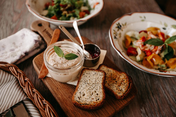 Pate on a wooden board and toast