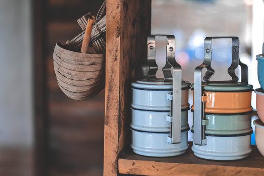 Close-Up Of Wicker Basket And Tiffins At Home