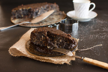 Poppy seed cake with nuts and raisins topped with dark chocolate..