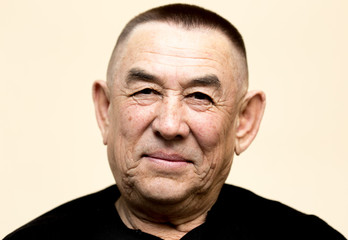 Portrait of an attractive man age with short hair.