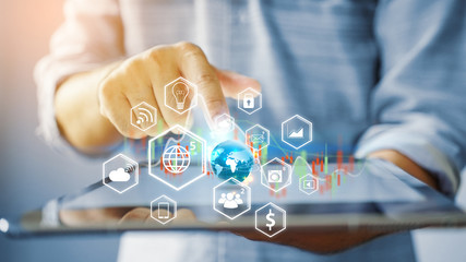 hand holding tablet with social icons. Globalization business