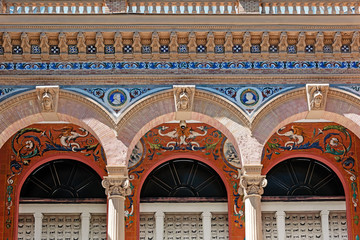 Obraz premium Part of building of Palacio de la Velasquez at El Retiro Madrid, made by ceramic mosaic in spanish style