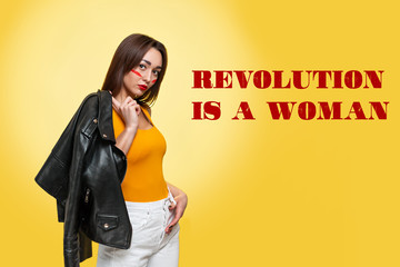 The concept of equal rights and feminism. Portrait a Caucasian woman with makeup, who is holding a...