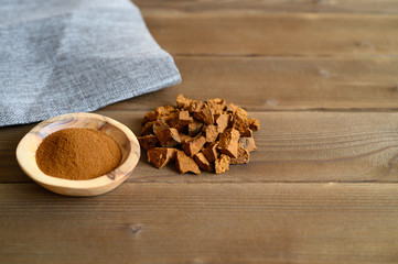 Fototapeta na wymiar chaga tea mushroom from birch tree using for healing tea or coffee in folk medicine. ground powder