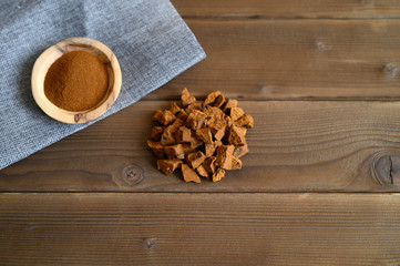 chaga tea mushroom from birch tree using for healing tea or coffee in folk medicine. ground powder