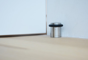 A doorstop (also door stopper, door stop is an object or device used to hold a door open or closed,...