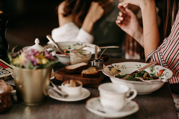 Two girls have lunch in a restaurant