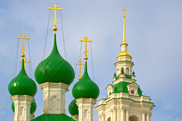 The majestic golden crosses and green domes of the Church of Our Savior. Kostroma, Russia.