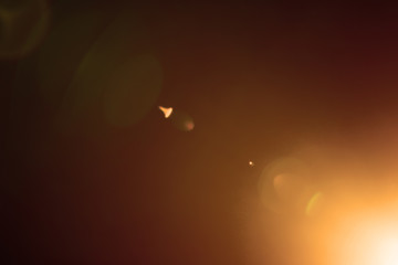 Flash of a distant abstract star. Abstract sun flare. The lens flare is subject to digital...