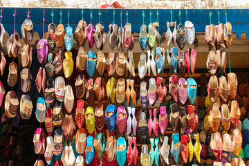 Multicolored traditional handmade shoes at the Moroccan oriental bazaar