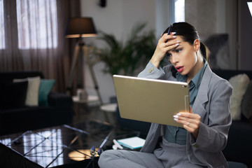 attractive business woman holding an tablet