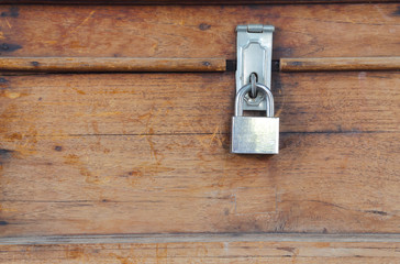 lock on the door of an old wood box