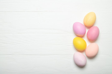 Multi-colored Easter eggs on a white background. With place for text.