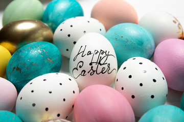 Fototapeta na wymiar Colorful easter eggs on white background. Close-up