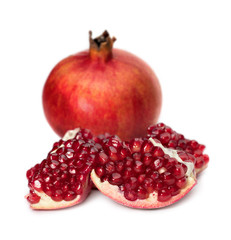 Pomegranates with pomegranate seeds on a white background.