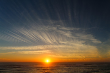 Sunset on the ocean with beautiful clouds