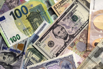 A lot of banknotes from different countries, money background. Dollars, euros, hryvnias, Russian rubles, Belarusian rubles and others.