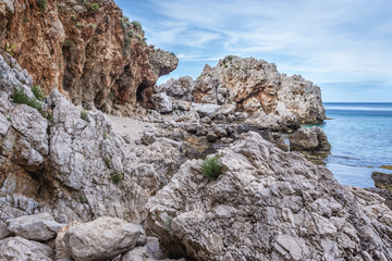 Rocsky shore of so called Disa beach in Zingaro park, oldest nature reserve on Sicily Island in Italy
