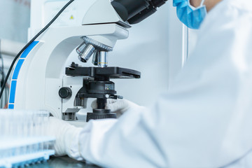 Doctor is using microscope to observe samples