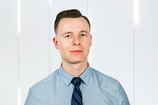 Portrait Of Young Man Businessman Dressed In Blue Shirt And Tie