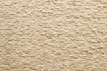 Rectangular marble tiles in beige color. Beige marble wall texture Wallpaper background