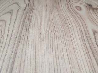 Wooden background made of natural wood with pattern of lines and knot used in flooring and home decoration in beige color