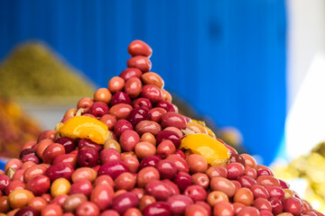 A bunch of olives on the counter of the Moroccan market