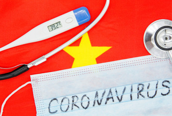 Coronavirus 2019-nCoV concept. Protective breathing mask on flag of Vietnam.