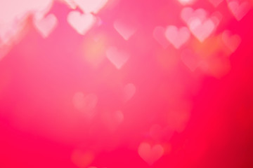 Red heat passionate and glamour bright bokeh background.Heart shaped bokeh red abstract background banner.  Love theme illustration. Valentines day concept. Copy space. Decorative glitter design.
