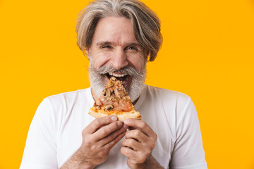 Emotional senior man holding pizza.