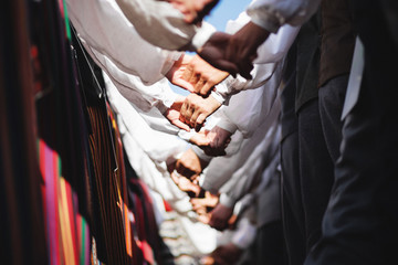 People holding hands in folk costumes
