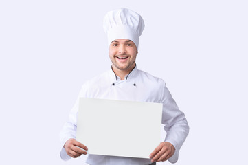 Chef Man Holding Blank Poster For Text, Studio Shot, Mockup