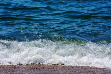 Wave of the sea on the sand beach