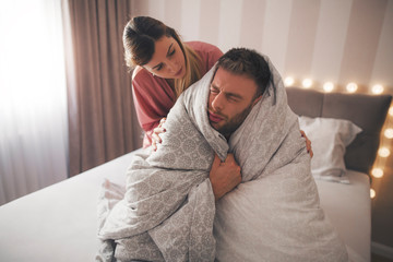 Girl taking care of her sick boyfriend.