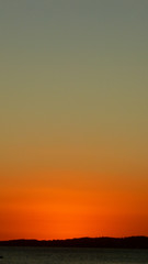 Fototapeta premium Minimalist photography with dramatic orange sky during twilight