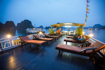 Fototapeta na wymiar Upper deck of the boat anchored in a calm lagoon in Ha Long Bay. Vietnam