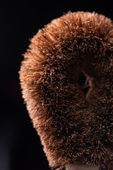 Close-up of a coconut cleansing brush. Zero waste concept