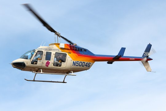 GRAND CANYON, USA - APRIL 3, 2014: Tourists ride in Papillon Helicopters flightseeing in Grand Canyon National Park in Arizona. 4.56 million tourists visited Grand Canyon in 2013.