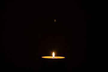 Fototapeta premium Abstract flame of a candle in the dark