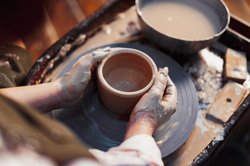 Girl Hands Sculpting Crockery on Pottery Wheel From Clay. Creative Talented Person Creating Handmade Cutlery.