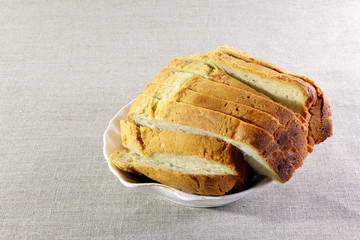 Sliced  white bread Bright background. Linen.