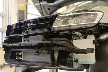 Car with front bumper removed. Car body repair.