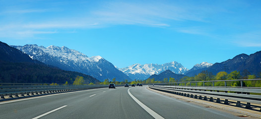 highway to Garmisch, with some cars, view to Wetterstein mountains, at springtime